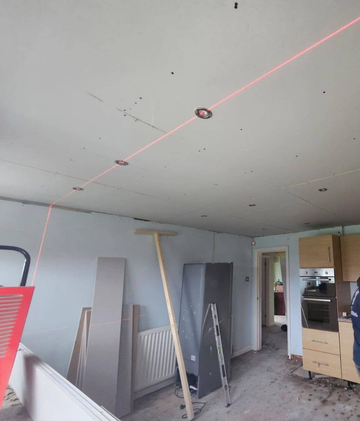 The CK Damp Specialist team setting out a ceiling