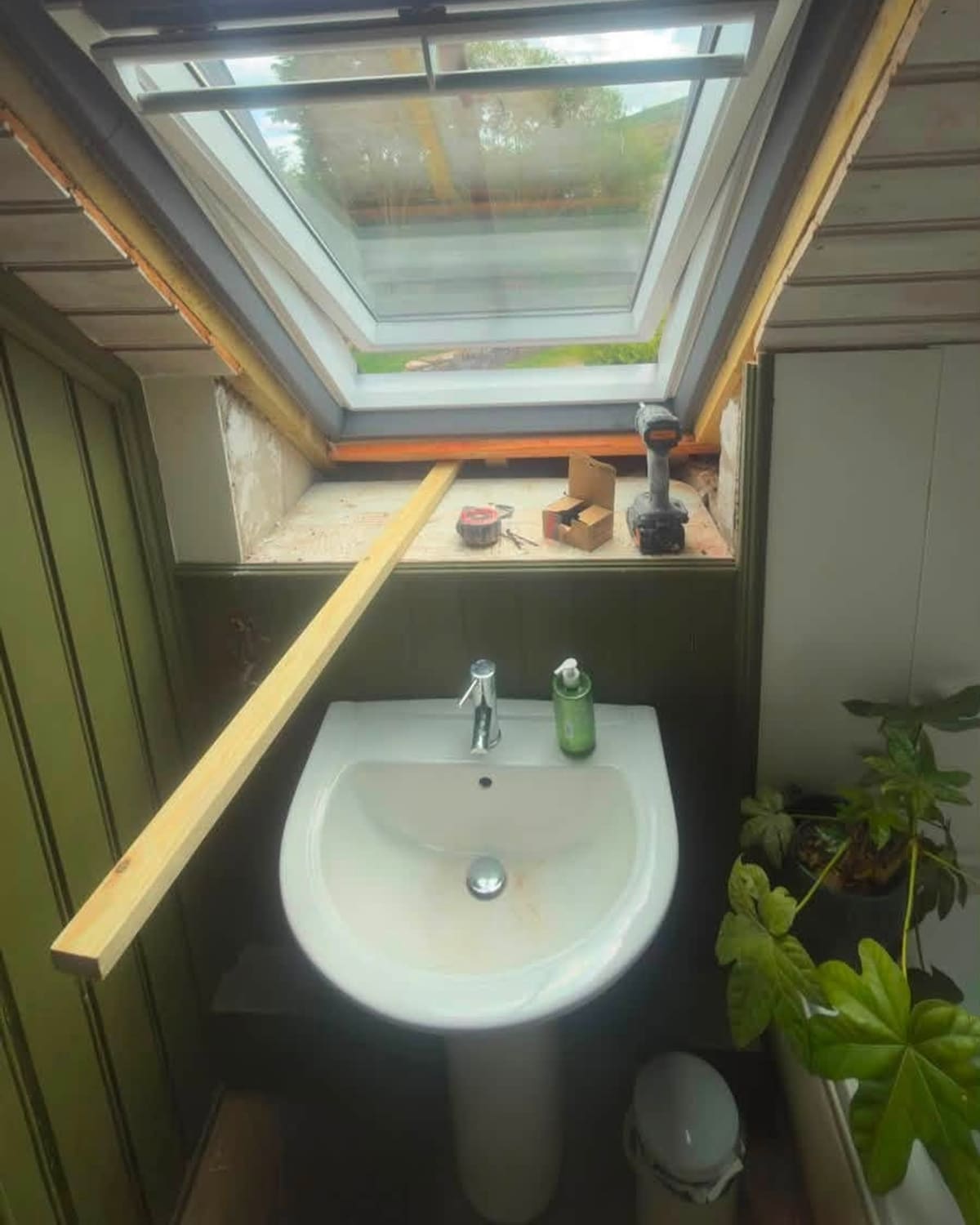 A freshly skimmed skylight reveal above a bathroom basin, before and after plastering